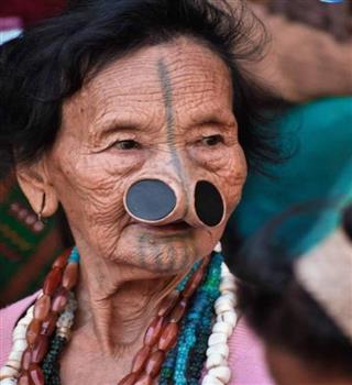Why do Indian Apatani tribe women have nose plugs?