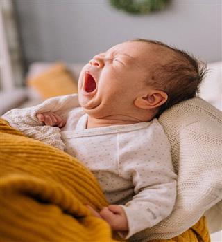 Why do we yawn when we see someone else yawning?