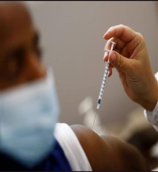 Why do doctors flick syringes?