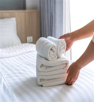 Why do hotels use white sheets and towels?