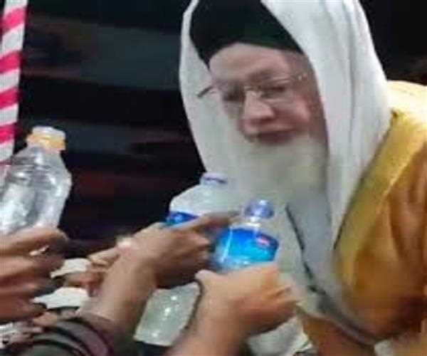 Why do Muslim cleric spits into water bottles?